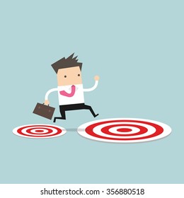 Businessman jumping from small target to the big target.
