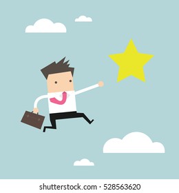 Businessman jumps to reach out for the star.