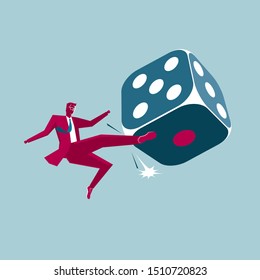 Businessman kicks a huge dice. Isolated on blue background.