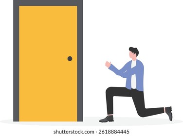 Businessman kneels in front of the door and prays to open the door

