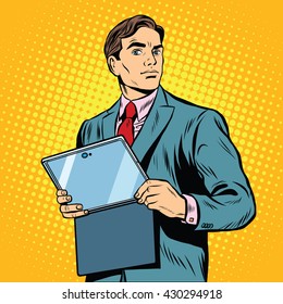 Businessman with laptop or tablet