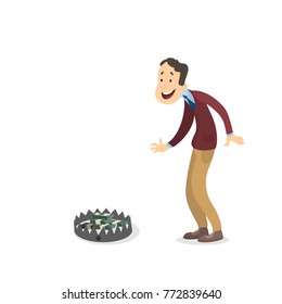 Businessman looking at bear trap with money on white.