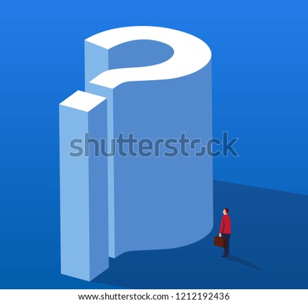 Businessman looking up at huge question mark