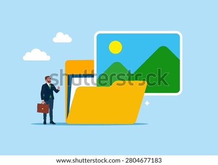 Businessman looking on huge folder with Image album symbol. Organizing file and document in database. Flat style vector illustration
