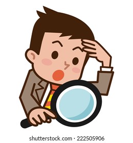Businessman looking through a magnifying glass