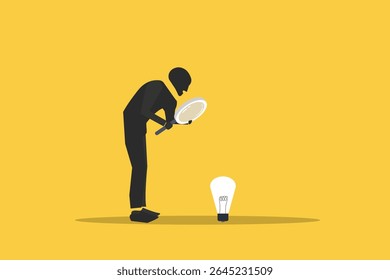 Businessman with Magnifying glass looking idea lightbulb, concept of startup idea and problem solving