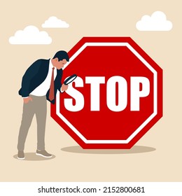 Businessman With Magnifying Monitor And Investigate Incident With Stop Sign. Incident Management, Root Cause Analysis Or Solving Problem, Identify Risk Or Critical Failure Concept.