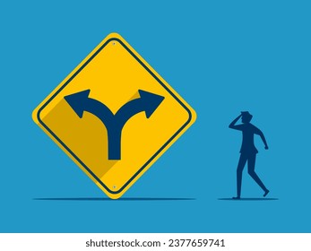 Businessman makes decision with two way intersection sign