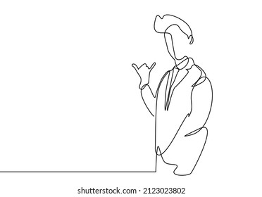 a businessman is making a phone call sign with his fingers