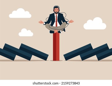Businessman meditating on unique red domino tile among falling black dominoes. Be different concept