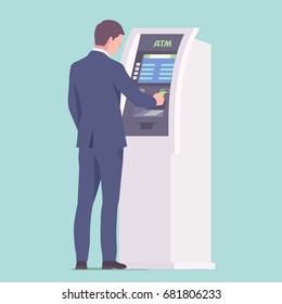 Businessman near ATM with credit card in hand. Vector illustration