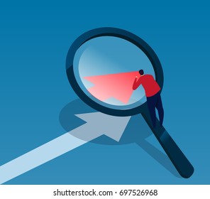 Businessman observes data with magnifying glass