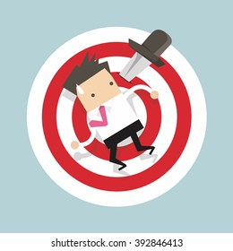 Businessman on target with knife vector