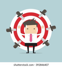 Businessman on target with knives vector