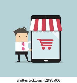 Businessman with online shop on tablet. Online shopping concept. Web store.