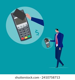 Businessman, online shopping, e-commerce Pay by credit card with a card swipe machine and
Tap your debit or credit card at the swiping machine to pay.