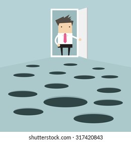 Businessman open the door and looks at hole on the ground