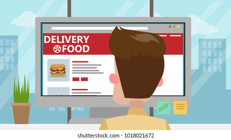 Businessman ordering food from computer in office.