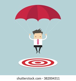 Businessman With Parachute Focused On A Target