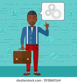 Businessman pointing at cogwheels.