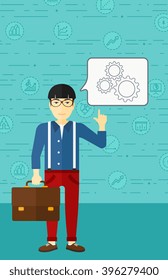 Businessman pointing at cogwheels.