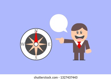 Businessman pointing at Compass