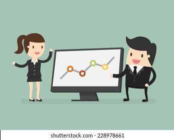 Businessman pointing at graph during discussion at meeting