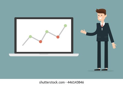 Businessman pointing at graph in laptop