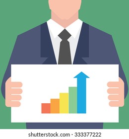 Businessman pointing at growth graph