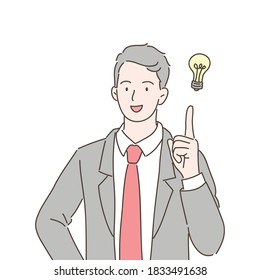 businessman pointing at light bulb as a symbol of having an idea. Vector illustration in hand drawn style