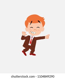 Businessman pointing to something funny on his left.