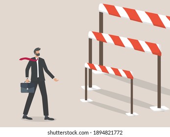 Businessman problems and challenges, businessman standing in front of a Barrier or hurdle.