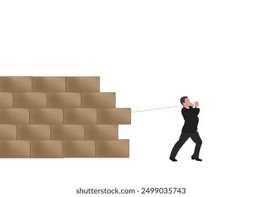 Businessman pulling a rope trying to break down a brick wall
