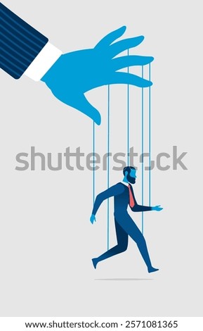 Businessman puppet connected to strings and manipulated by a huge hand