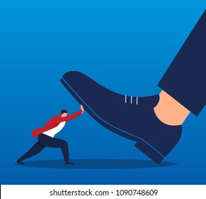 Businessman pushes the giant's foot away