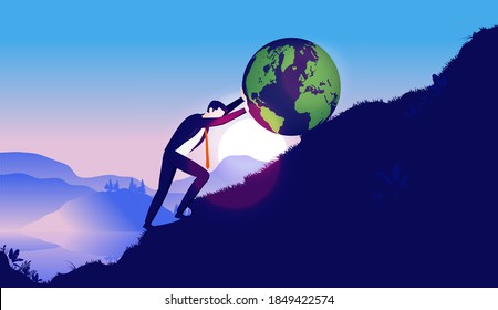 Businessman pushing earth up hill - Man working hard to earth up mountain. Business responsibility and globalisation concept