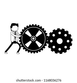 Businessman pushing gears in black and white