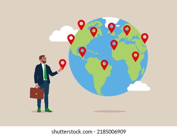 Businessman put new branch pin on world map across globe.Global business expansion, open company branches, franchise in new location to cover all continent, growing business worldwide.