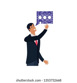 businessman with puzzle pieces in shape speech bubble