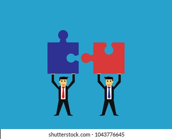 businessman raised jigsaw puzzle,business teamwork concept