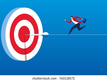 The businessman ran to the bull's eye with the dart