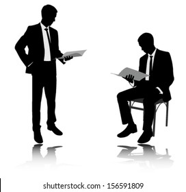 businessman reading report silhouettes