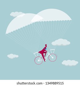 Businessman riding a bicycle to airborne. The white clouds are in the sky.