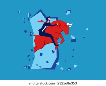 Businessman riding a bull breaking the barrier of the wall. investing in the bull market