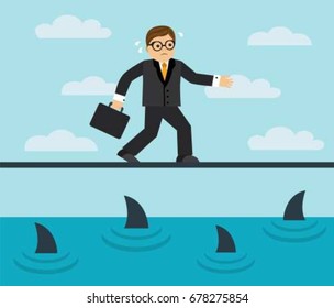 Businessman risks and goes on a tightrope over the sea full of sharks