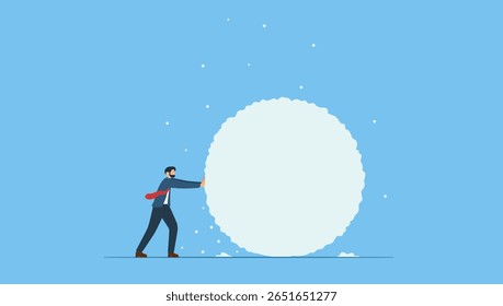 Businessman rolling large snowball build up from small getting bigger. Symbol of snowball effect from small build up larger with potential risk, financial growth or mistake.