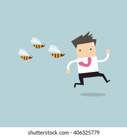 Businessman running away from dangerous insects