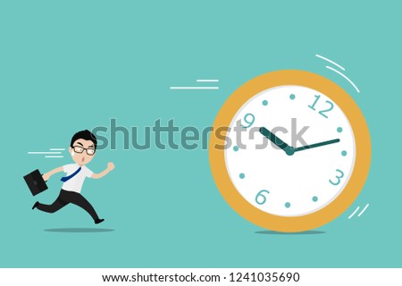Businessman running chase a rolling time. Business concept