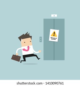 Businessman are running to the elevator. But the elevator is out of service.