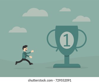 Businessman running toward a big trophy